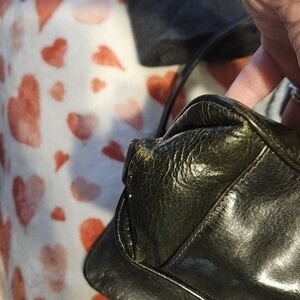 A dark green leather bag